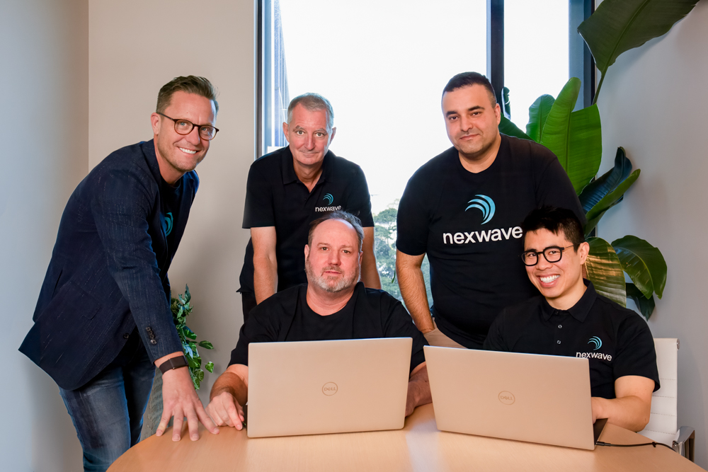 The nexwave team collaborating in their office.